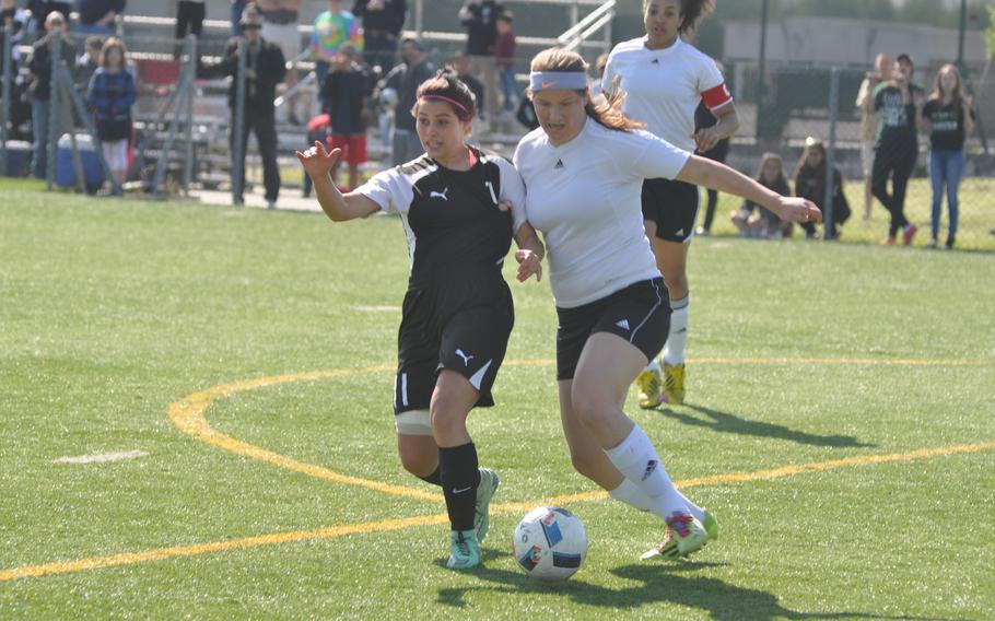 Stuttgart's Kaitlyn Farrar, left, and Vicenza's Kiki Sibilla battle for the ball Friday in the Panthers' 7-0 victory over the Cougars in Vicenza, Italy.