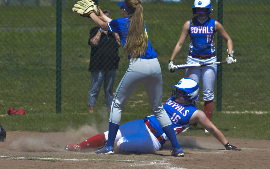 Ramstein's Allison Holmes avoids a tag by Wiesbaden's Gillian Moszer at home plate during a doubleheader between the Royals and Warriors at Wiesbaden, May 7, 2016. Defending Division I champ Ramstein won both games by double digits.