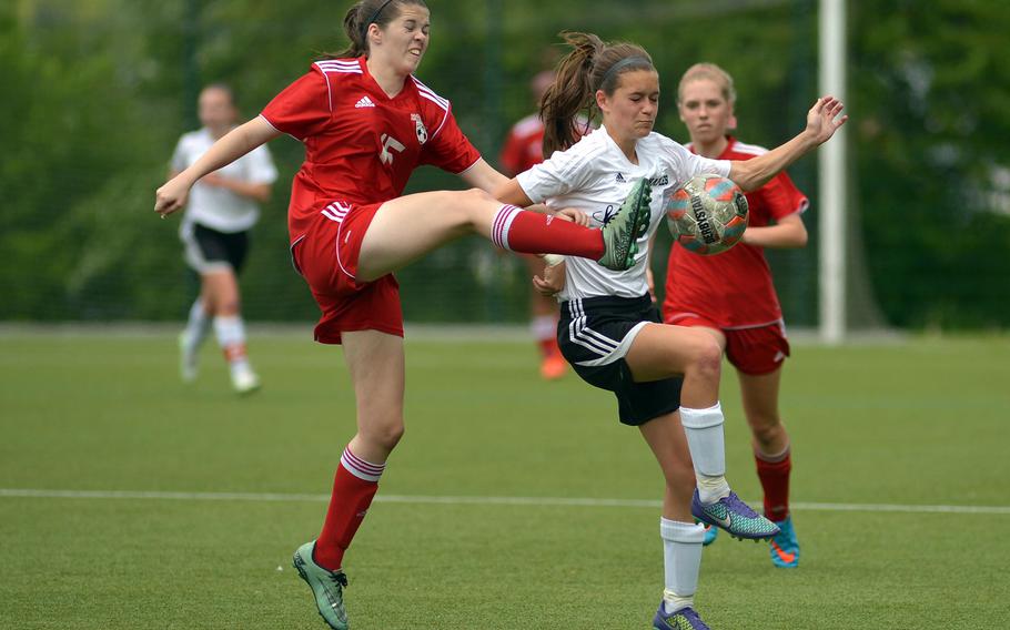 Kaiserslautern's Bethany Salas, left, clears the ball in front of Naples' Micayla Feltner in a Division I game on opening day of the DODEA-Europe soccer championships in Reichenbach-Steegen, Germany, Wednesday, May 18, 2016. Naples won 4-2.




