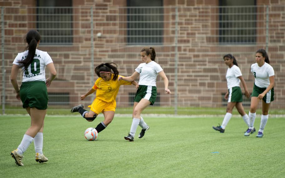 Ankara's Sophie Engstrom, center, tries to block Baumholder's Karina Inchauregui during the DODEA-Europe soccer tournament in Landstuhl, Germany, on Wednesday, May 18, 2016. Baumholder won 3-0.
