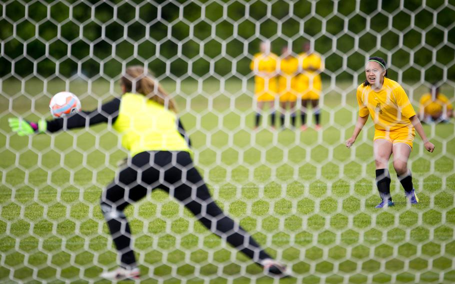 Baumholder's Alyssa Aledia, right, watches as Sigonella's goalkeeper Sam Sanders dives to block her shot during the DODEA-Europe soccer tournament in Landstuhl, Germany, on Thursday, May 19, 2016. Sigonella won 4-3 in a shootout.