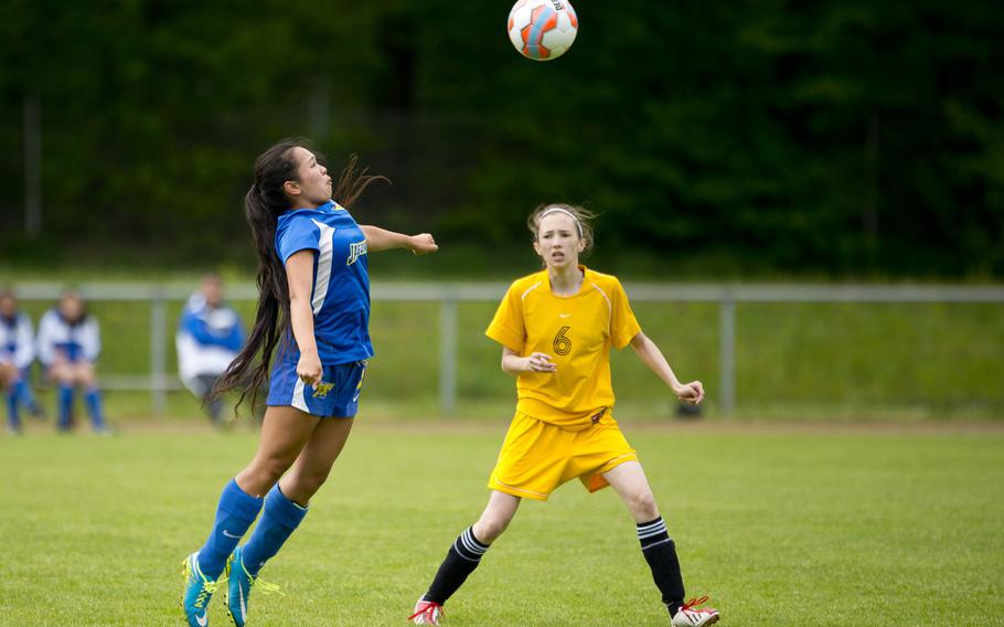 Sigonella's Maile Puertol, left, jumps to beat Baumholder's Celina Orozco to the ball during the DODEA-Europe soccer tournament in Landstuhl, Germany, on Thursday, May 19, 2016. Sigonella won the Division III match 4-3 in a shootout.