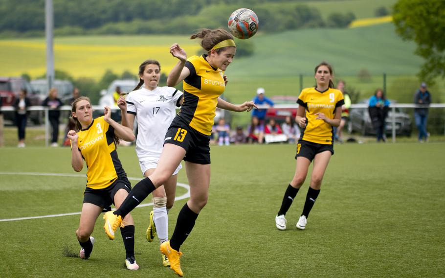 Stuttgart's Emily Ortwein, center, heads the ball during the DODEA-Europe soccer semifinals in Reichenbach, Germany, on Friday, May 20, 2016. Stuttgart won 4-2 in overtime.