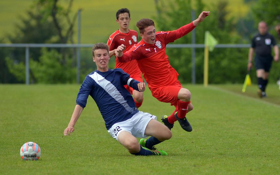 Lakenheath's Jacob Croft sends Kaiserslautern's Alex DeBella flying in Division I semifinal action at the DODEA-Europe soccer championships in Reichenbach-Steegen, Germany, Friday May 20, 2016. Lakenheath won the match in a shootout.