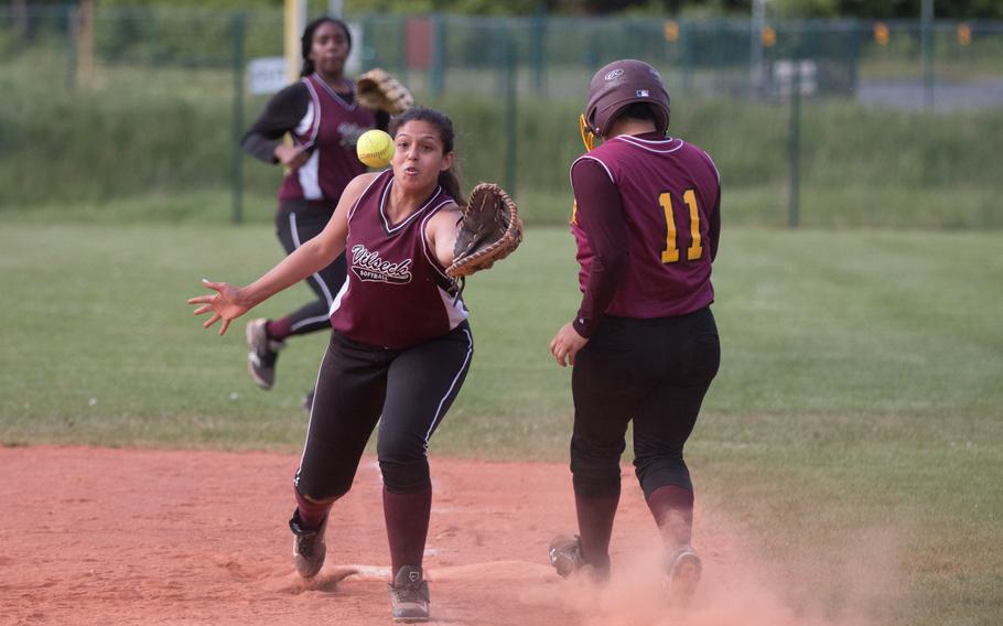 Baumholder's Marisol Espinoza beats the throw to first as Vilseck's Grace Torres stretches out during a doubleheader between the two teams in Vilseck, Germany on Friday, May 20, 2016.