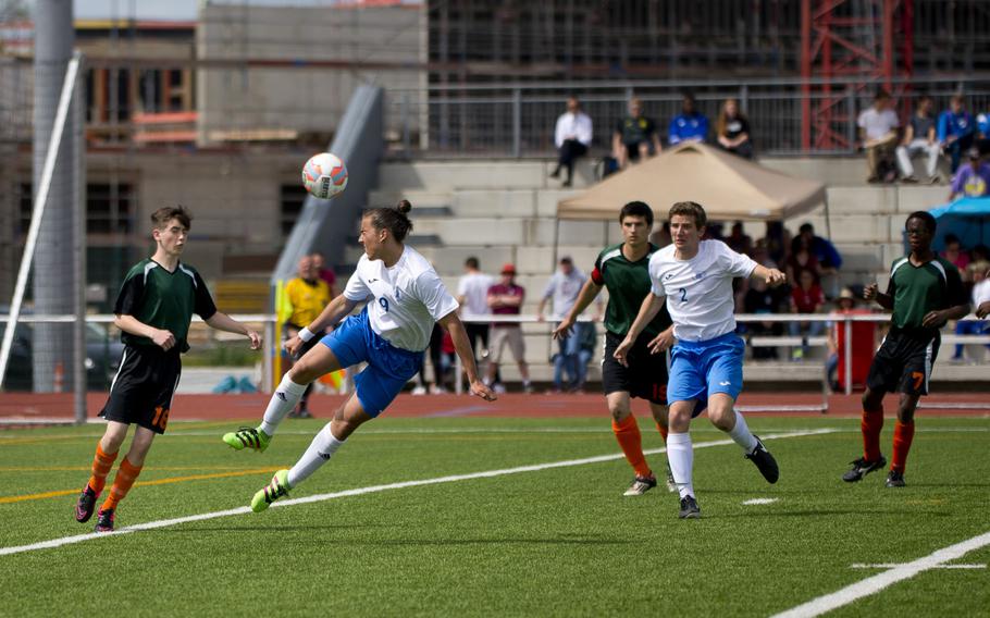 Marymount's Dante Marinetti, center, goes for a header during the DODEA-Europe soccer championship in Kaiserslautern, Germany, on Saturday, May 21, 2016. Marymount defeated AFNORTH to win the Division II game 7-0.