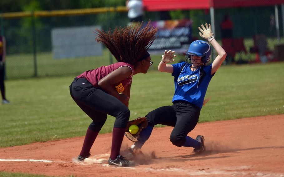 Hohenfels' Chalon Fulcher-Waller slides into third under the tag of Baumholder's Imaya Sharpe in a Division II/III game at the DODEA-Europe softball championships in Ramstein, Germany, Thursday, May 26, 2016.Hohenfels won 17-5.