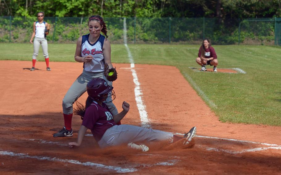 AFNORTH's Nyah August beats the tag by Bitburg's Leigha Dayranani in a Division II/III game at the DODEA-Europe softball championships in Ramstein, Germany, Thursday, May 26, 2016. Bitburg won the game 16-12.