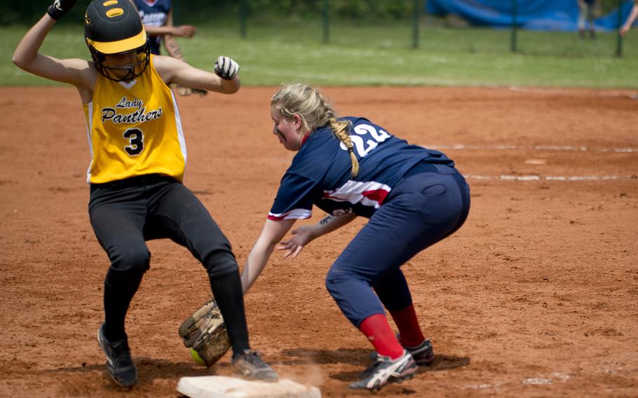 Stuttgart's Kendall Smith beats a tag by Lakenheath's Kaelyn Kinser at third during the DODEA-Europe softball tournament at Ramstein Air Base, Germany, on Friday, May 27, 2016. Stuttgart won the game 16-0.