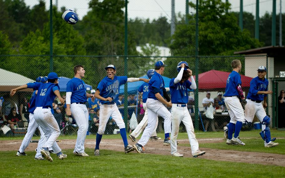 The Rota Admirals celebrate winning the DODEA-Europe Division II/III baseball championship at Ramstein Air Base, Germany, on Saturday, May 28, 2016. Rota defeated the Bitburg Barons 5-4 to win the title.