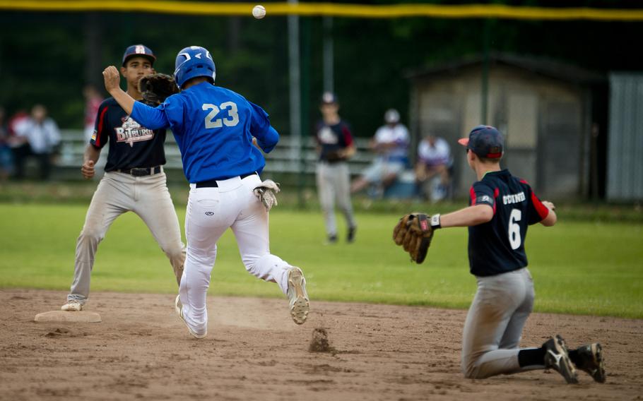 Bitburg's Matthew O'Connor, right, throws to Tyriq Zvijer at second over Rota's Derek Pena during the DODEA-Europe Division II/III baseball championship at Ramstein Air Base, Germany, on Saturday, May 28, 2016. Bitburg lost the game 5-4.