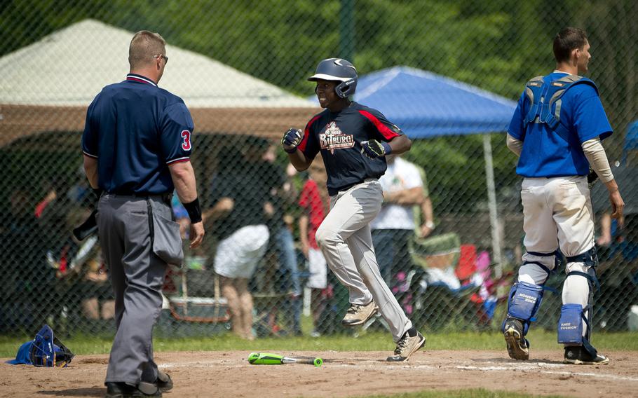 Bitburg's Jermaine Cooks runs in to home during the DODEA-Europe Division II/III baseball championship at Ramstein Air Base, Germany, on Saturday, May 28, 2016. Bitburg lost the game against Rota 5-4.