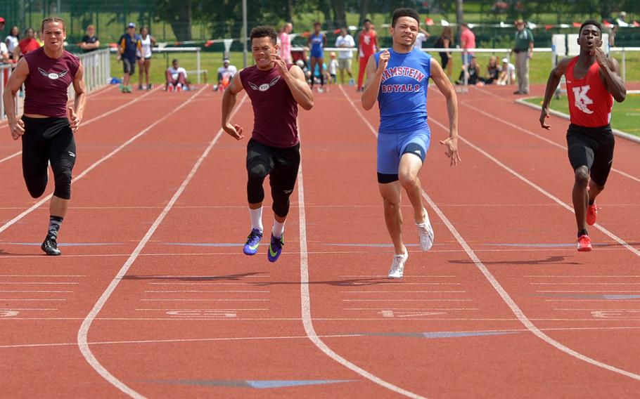 Ramstein's Yson Hogan won the boys 100-meter dash in a close race against Vilseck's Jacolby Hull-Town at the DODEA-Europe track and field championships in Kaiserslautern, Germany, Saturday, May 28, 2016. Hogan won in 10.94 seconds to Hull-Town's 11.00. At right is Kaiserslautern's Omar Plaisime who finished third, at left is Vilseck's Zavier Scott who finished fourth.