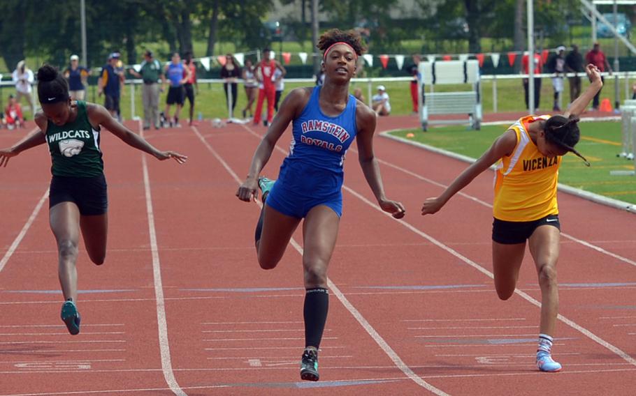 Ramstein's Denee Lawrence won the girls 100-meter dash in 12.54 seconds at the DODEA-Europe track and field championships in Kaiserslautern, Germany, Saturday, May 28, 2016. At left is Naples' Kayla Music who finished sixth. At right is third-place finisher Brandy James of Vicenza.