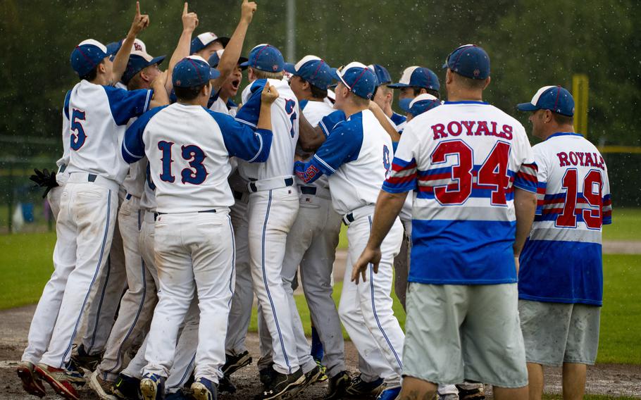 The Ramstein Royals celebrate winning the DODEA-Europe Division I baseball championship at Ramstein Air Base, Germany, on Saturday, May 28, 2016. Ramstein defeated the Kaiserslautern Raiders 3-0 to win the title.