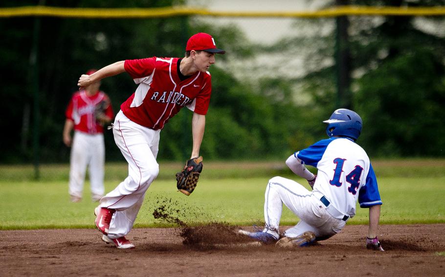 Ramstein's Tieran Shoffner, right, slides in to second ahead of a tag by Kaiserslautern's Nick Nygren during the DODEA-Europe Division I baseball championship at Ramstein Air Base, Germany, on Saturday, May 28, 2016. Ramstein won 3-0.
