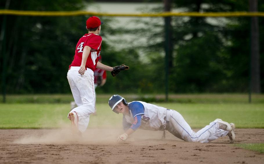 Ramstein's Reed Marshall, right, slides in to second ahead of a tag by Kaiserslautern's Nick Nygren during the DODEA-Europe Division I baseball championship at Ramstein Air Base, Germany, on Saturday, May 28, 2016. Ramstein won 3-0.