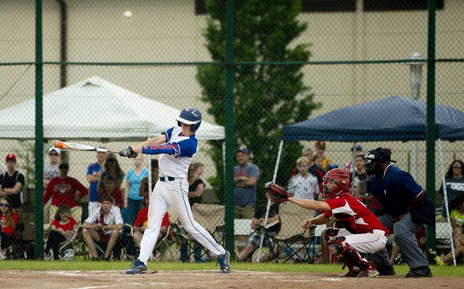 Ramstein's Daniel Thompson hits a fly ball during the DODEA-Europe Division I baseball championship at Ramstein Air Base, Germany, on Saturday, May 28, 2016. Ramstein defeated Kaiserslautern 3-0 to win the title.