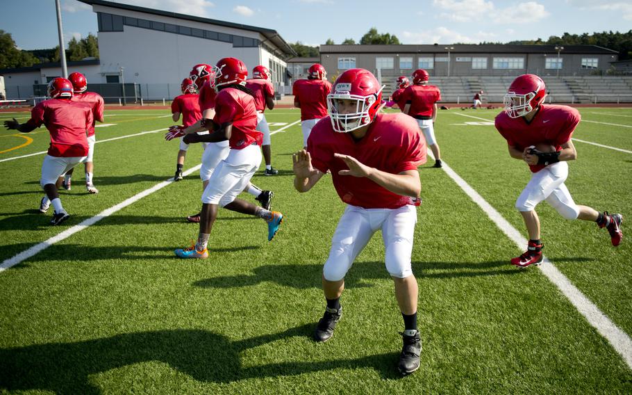 The Kaiserslautern Raiders run offensive plays during practice at Vogelweh, Germany, on Tuesday, Aug. 30, 2016.