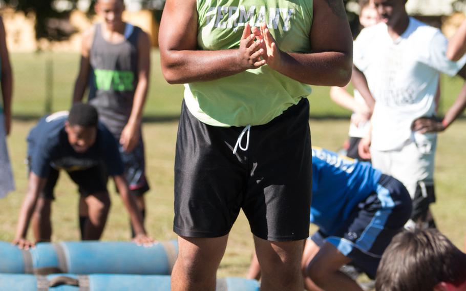 Vilseck senior Derek Davis glowers at the bag as he does burpees during a pre-season football practice held on Friday, Aug. 26, 2016 in Vilseck, Germany. 