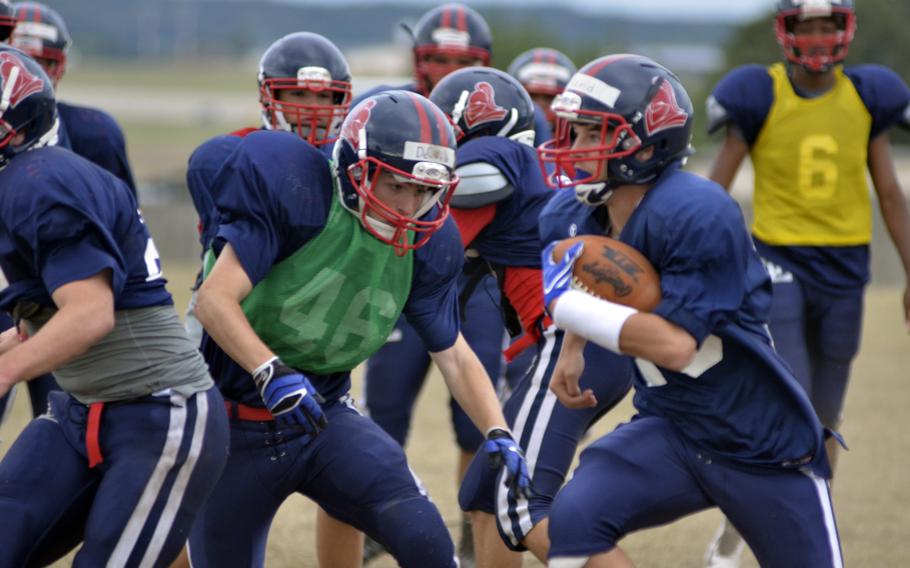 Lakenheath Lancers perform offensive drills during after-school practice at RAF Lakenheath, England, Wednesday, Aug. 31, 2016. The Lancers came out of a long slump last year with a playoff appearance for the first time in 11 years.