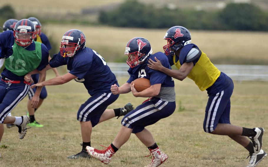 Lakenheath Lancers perform offensive drills during after-school practice at RAF Lakenheath, England, Wednesday, Aug. 31, 2016. The  Lancers return to the football field this year with an expected roster of 35 athletes including 12 returning players.