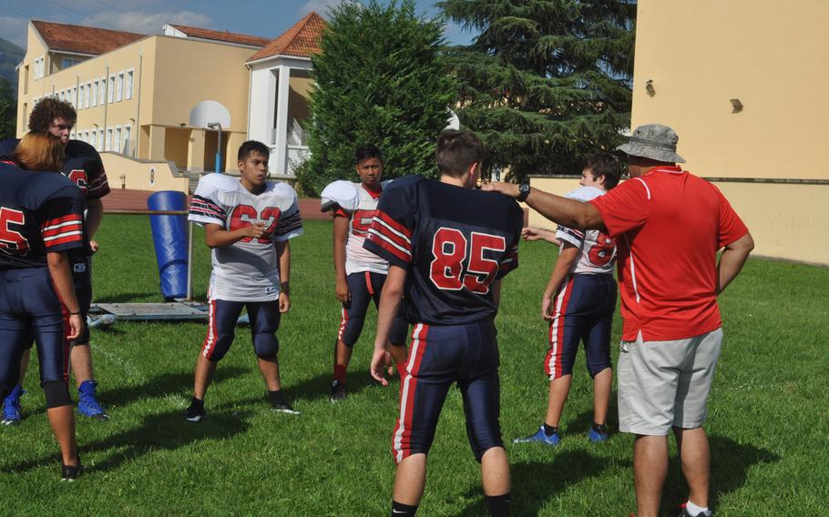 Aviano assistant coach Oliver Herazo has the attention of budding linemen during a recent practice.