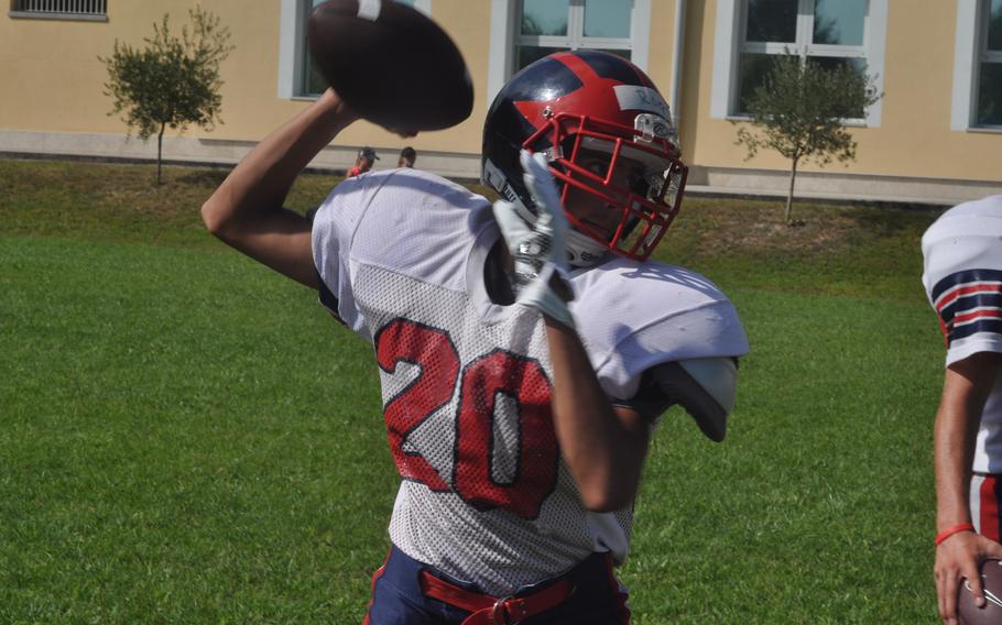 Hayden Roers, one of only three returning starters for the Aviano Saints, fires a pass during a recent practice.