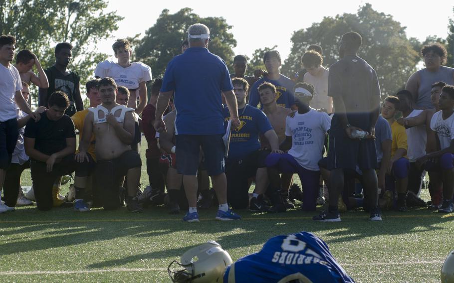 Wiesbaden football head coach Steve Jewell, center, speaks to his players at the end of a practice session Wednesday, Sept. 7, 2016. Jewell's squad will be hoping to at least match last season's runner-up status in Division I despite losing several key seniors.