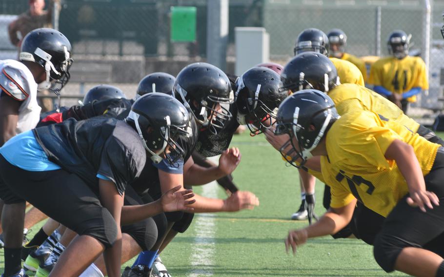Vicenza's first-team defense, right, takes on the offense Wednesday, Sept. 7, 2016, during a practice at Caserma Ederle in Italy.