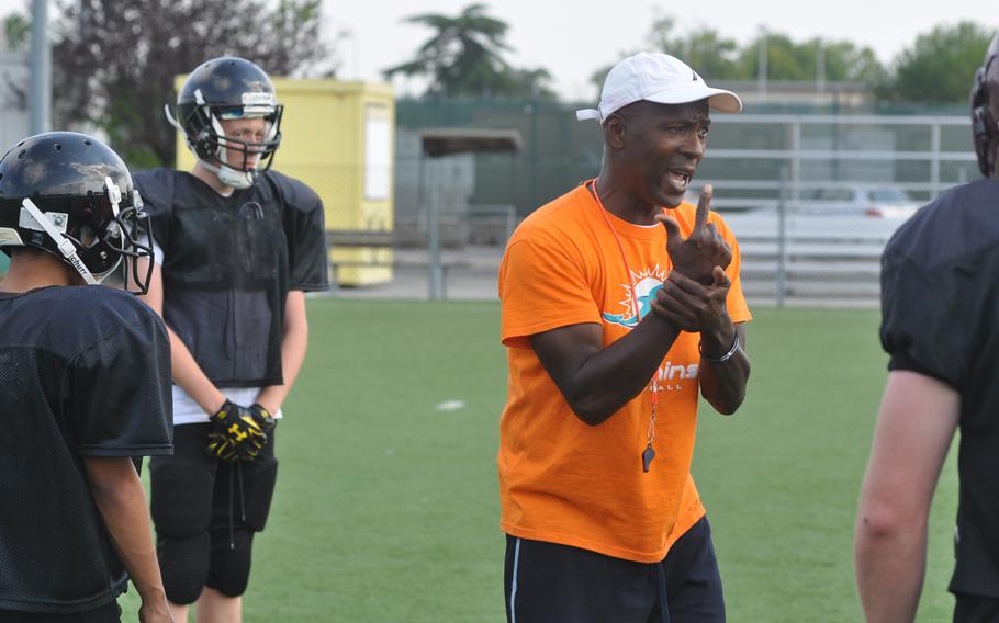 Vicenza head coach Jesse Woods makes a point to linemen during a practice Wednesday, Sept. 7, 2016, at Caserma Ederle in Italy.