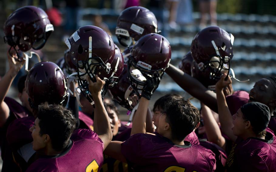 The Baumholder Bucs celebrate their 44-34 win against the Aviano Saints in Baumholder, Germany, on Saturday, Sept. 10, 2016.