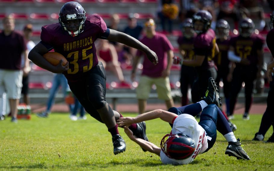 Baumholder Buc Yorel Smalls runs past an Aviano defender in Baumholder, Germany, on Saturday, Sept. 10, 2016. The Bucs won the game 44-34. 