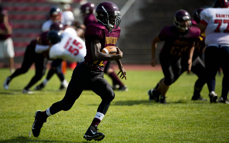 Baumholder Buc Nate Horton runs through a gap in Aviano's defense in Baumholder, Germany, on Saturday, Sept. 10, 2016. Baumholder won the game 44-34. 