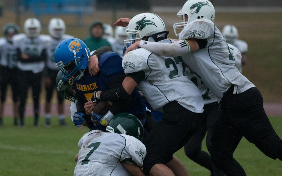 Ansbach sophomore running back/bulldozer Ramon Peguero carries half of the Naples defense during the second half of the meeting between the two squads in Ansbach, Germany on Saturday, Sept. 17, 2016. Ansbach was victorious, 22-12. 