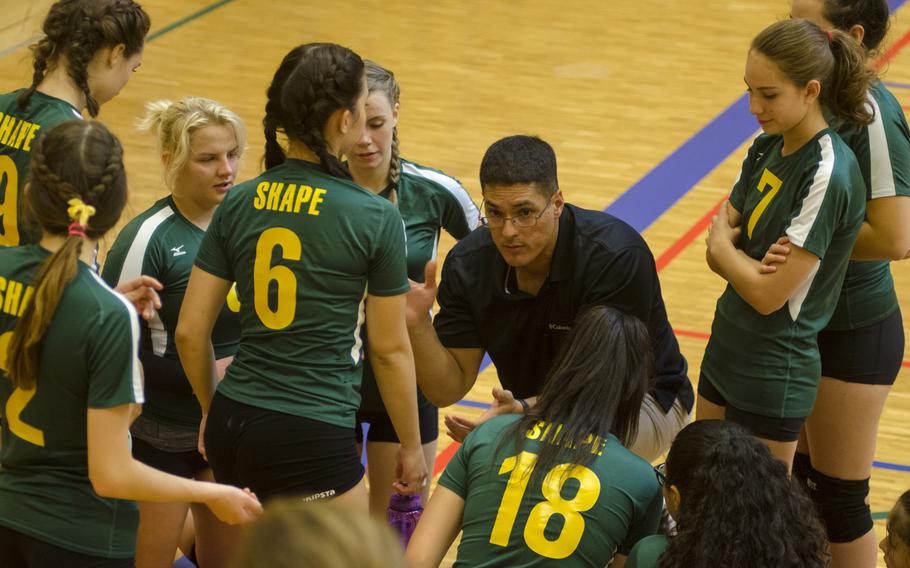 SHAPE coach Ricardo Carreras, center, speaks to his players during a timeout during a three-team round-robin match series Saturday, Sept. 17, 2016 at Wiesbaden, Germany. SHAPE split its games against Wiesbaden and Kaiserslautern.