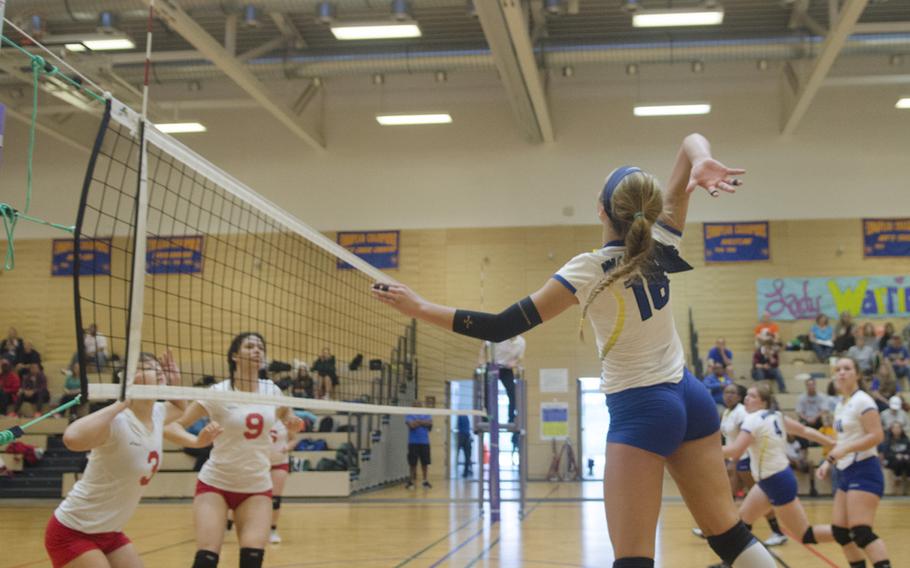 Mallory Johnson, right, of Wiesbaden, prepares to spike the ball during a three-team round-robin match series Saturday, Sept. 17, 2016 at Wiesbaden, Germany. Johnson, a junior, is a new arrival and one of Wiesbaden's strong outside hitting contingent along with senior Brigantia O'Sadnick.