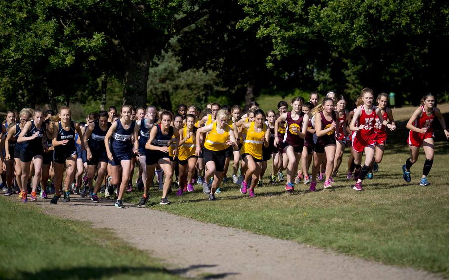 Runners take off from the starting line during a cross country meet in Ramstein-Miesenbach, Germany, on Saturday, Sept. 24, 2016. Seventy-three girls competed.
