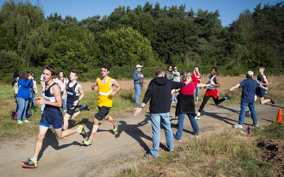 Runners round a corner during a cross country meet in Ramstein-Miesenbach, Germany, on Saturday, Sept. 24, 2016.