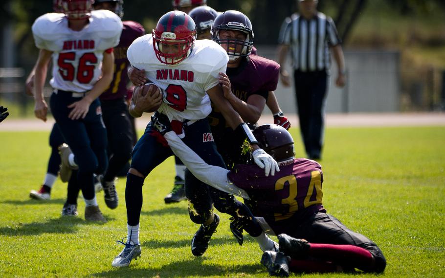 Aviano's Hayden Roers breaks through the Baumholder defense in Baumholder, Germany, on Saturday, Sept. 10, 2016. Aviano lost the game 44-34. Both teams have to win their games this week if they expect to be in the playoffs.