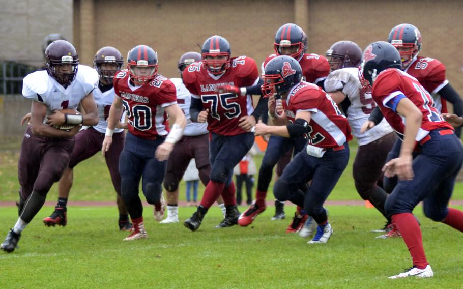 Vilseck's Cameron Downs rushes against Lakenheath during a game at RAF Lakenheath, England, Saturday, Oct. 1, 2016. Downs carried the ball 24 times for 142 yards.
