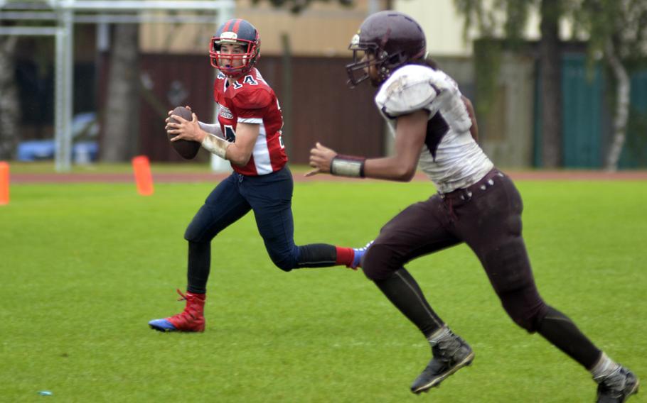 Lakenheath football player Tyler England runs a bootleg against Vilseck during a game at RAF Lakenheath, England, Saturday, Oct. 1, 2016. After their win against Vilseck the Lancers are undefeated in the conference.