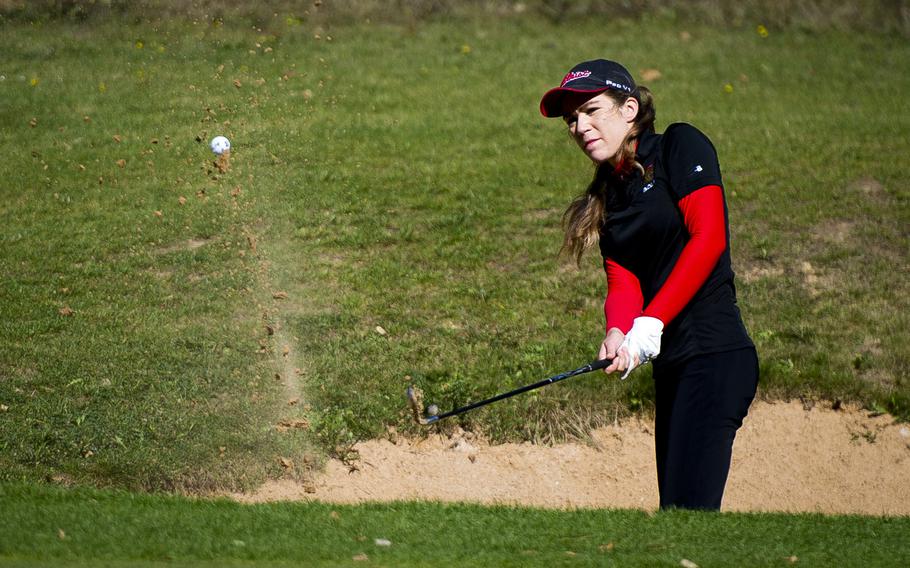Kaiserslautern's Jasmin Acker chips a shot from a sand bunker during the DODEA-Europe golf championship at Rheinblick golf course in Wiesbaden, Germany on Oct. 5, 2016.