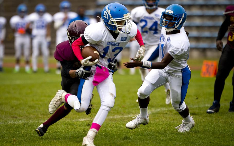 Rota's Ray Reyes tries to break a tackle in Baumholder, Germany, on Saturday, Oct. 8, 2016. Rota defeated Baumholder 45-0.