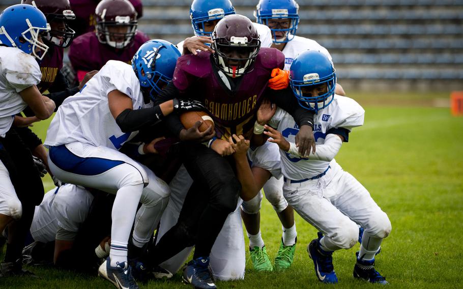 The Rota defense takes down Baumholder's Yorel Smalls in Baumholder, Germany, on Saturday, Oct. 8, 2016. Baumholder lost the game 45-0.