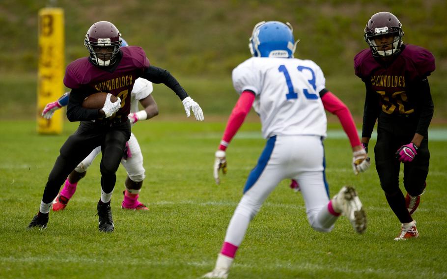 Baumholder's Nate Horton looks for a hole in Rota's defense in Baumholder, Germany, on Saturday, Oct. 8, 2016. The Baumholder Bucs lost the game 45-0.