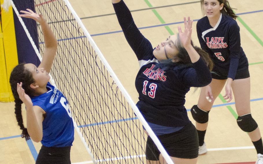 Bitburg's Elise Rasmussen, right, and Brussels' Gloria Hernandez vie for the ball over the net during their match Saturday, Oct. 15, 2016 at Spangdahlem, Germany. Brussels prevailed in five sets.