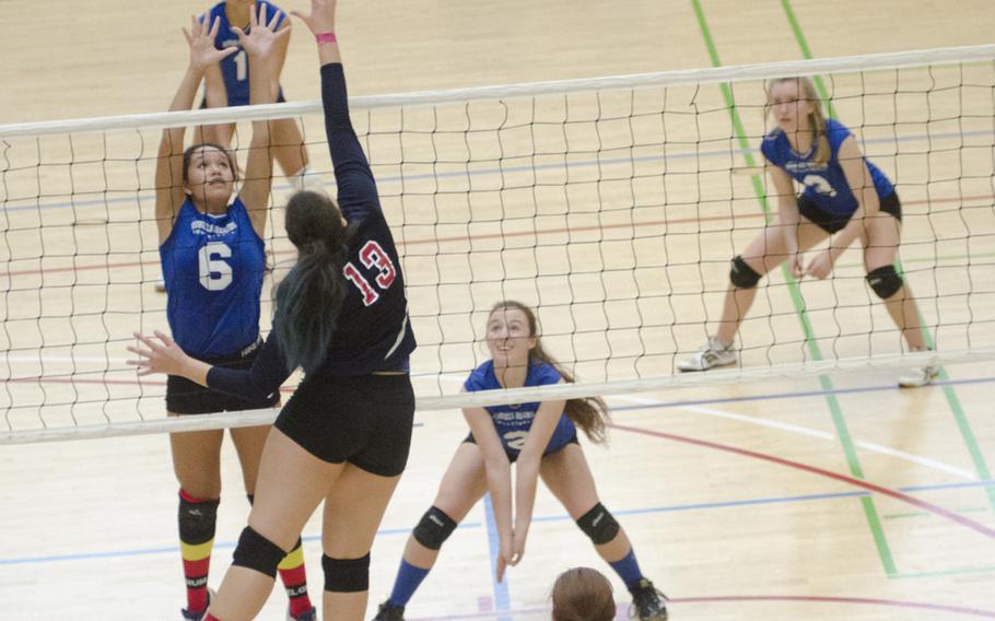 Elise Rasmussen of Bitburg spikes the ball against Glorida Hernandez of Brussels during their match Saturday, Oct. 15, 2016 at Spangdahlem, Germany. Rasmussen, a senior, was crucial as Bitburg fought back from a two-set deficit to take the match to a fifth set.