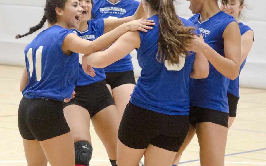 Brussels celebrates winning a set against Bitburg during their match Saturday, Oct. 15, 2016 in Spangdahlem, Germany. Brussels won the first two sets, lost the next two, and pulled out a narrow win in the decisive fifth set.