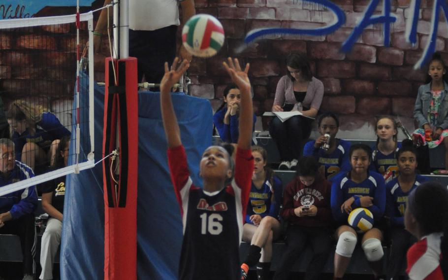 Aviano's Madisyn Walker sets the ball Saturday in a match against Hohenfels at Aviano Air Base, Italy.